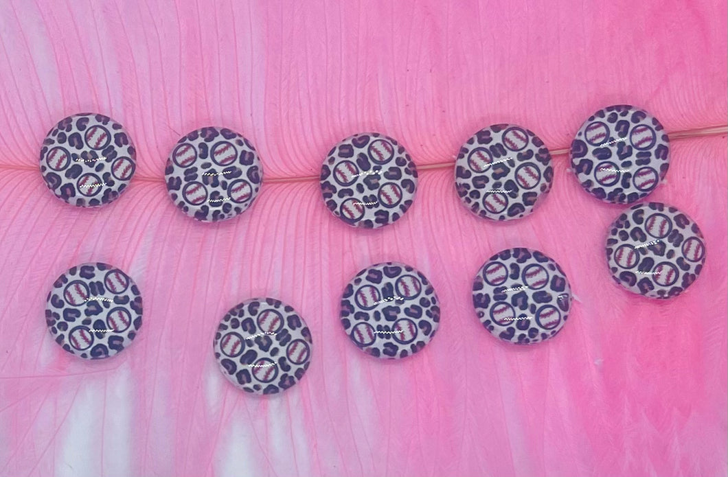 Mini baseballs and leopard print background